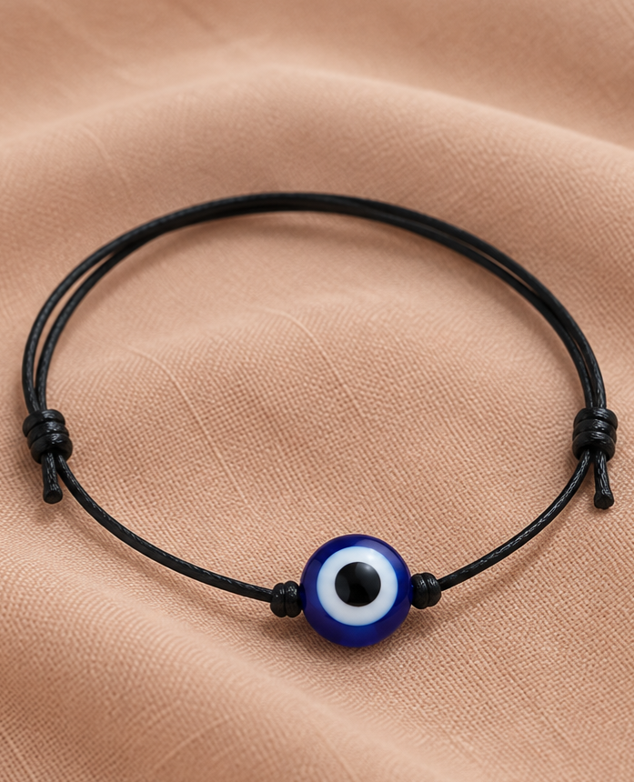 Apsauginė akis ant dirbtinės odos juostelės – apsaugos talismanas