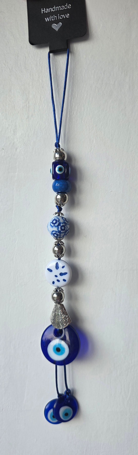 Turkio akis -simbolizuoja meilę, sėkmę ir apsaugą nuo nelaimių.Sumažina neigiamo poveiki,įvairias nesėkmes, konfliktus ar blogą savijautą namų aplinkoje.Sukuria patikimą energetinį barjerą, kuris saugo ir harmonizuoja namų bei šeimos narių aurą.