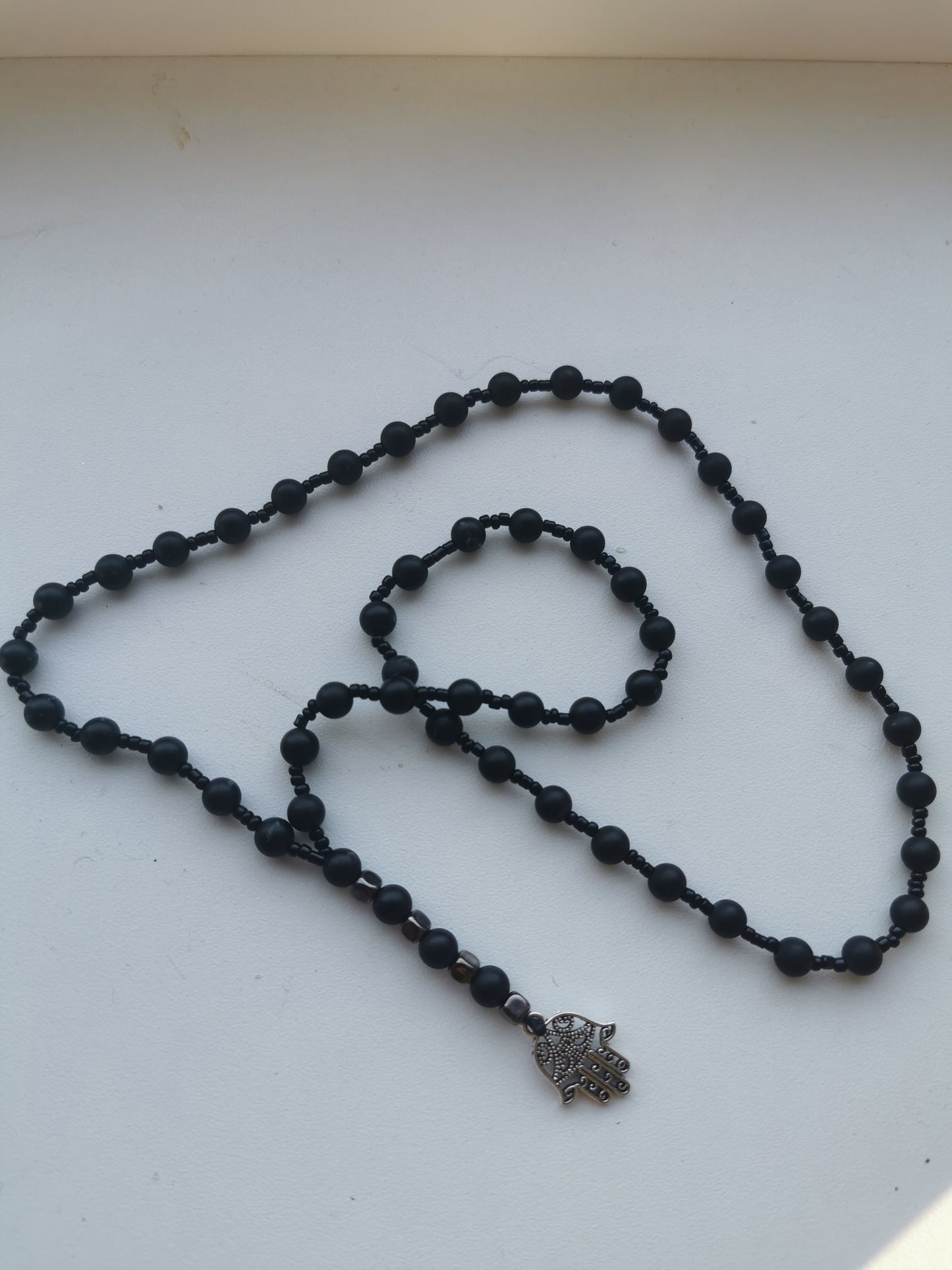 Fatimos ranka ir juodas agatas